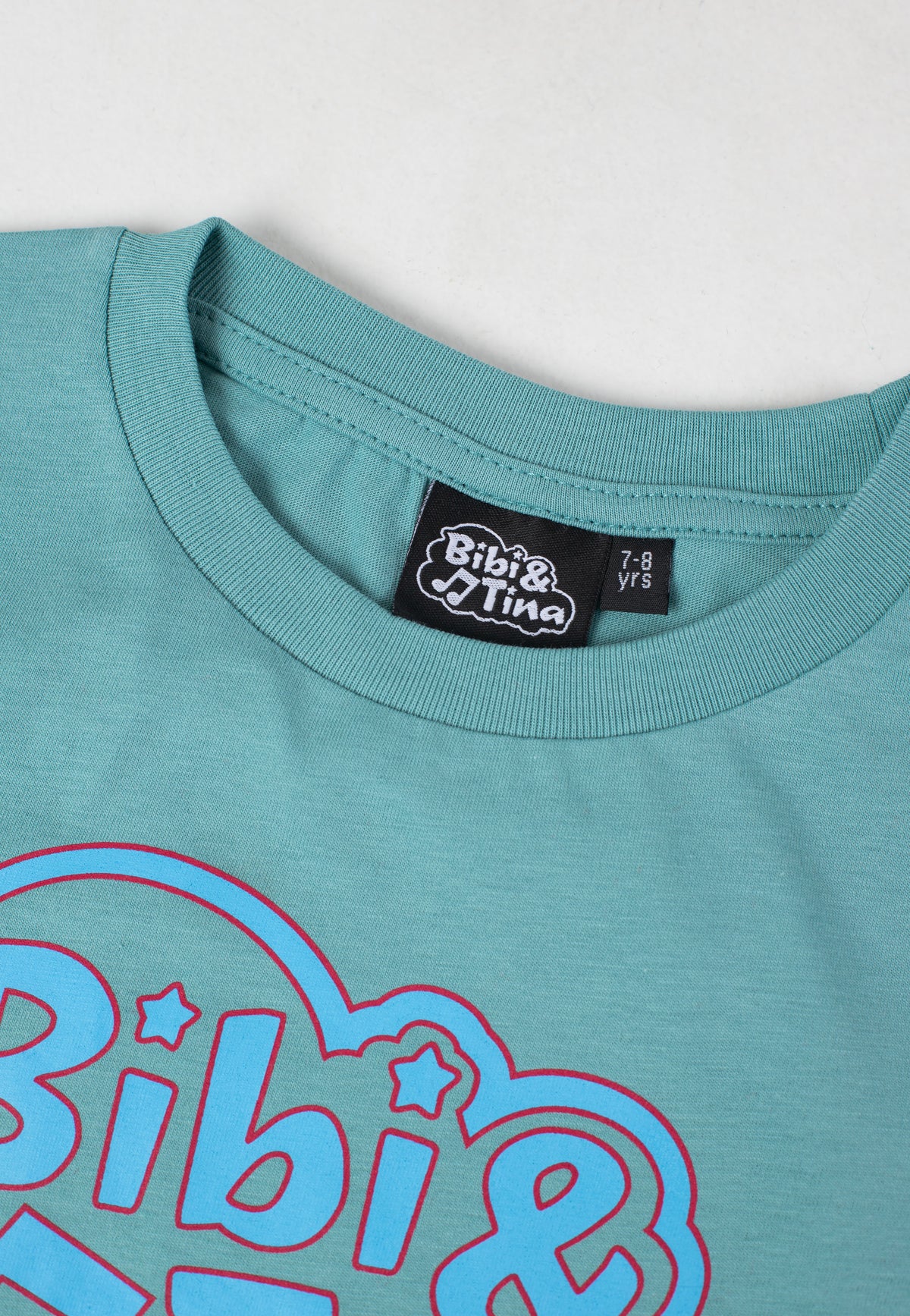 Bibi & Tina Up Up Up Logo 2022 Teal Monstera T-Shirt